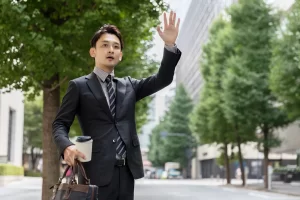 Young asian businessman waiting in the street